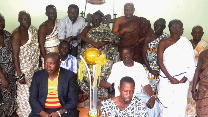 Nana Afari Yeboah Gyan II, Chief of Obo, receives the trophy and officials of the FA Cup committee